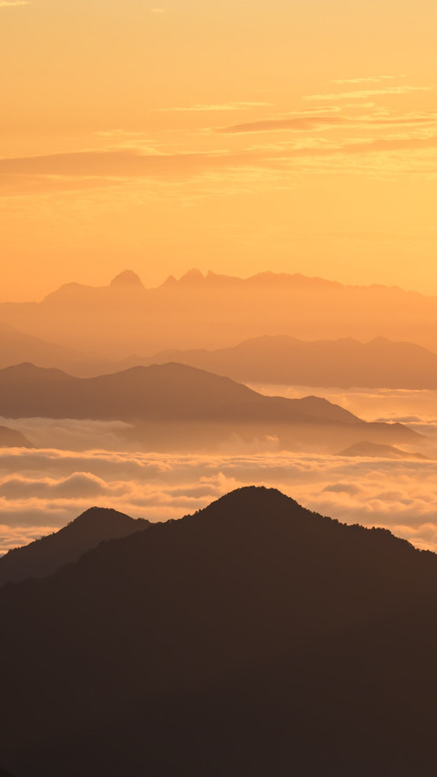 The mountain peak is bathed in the glow of the rosy preview