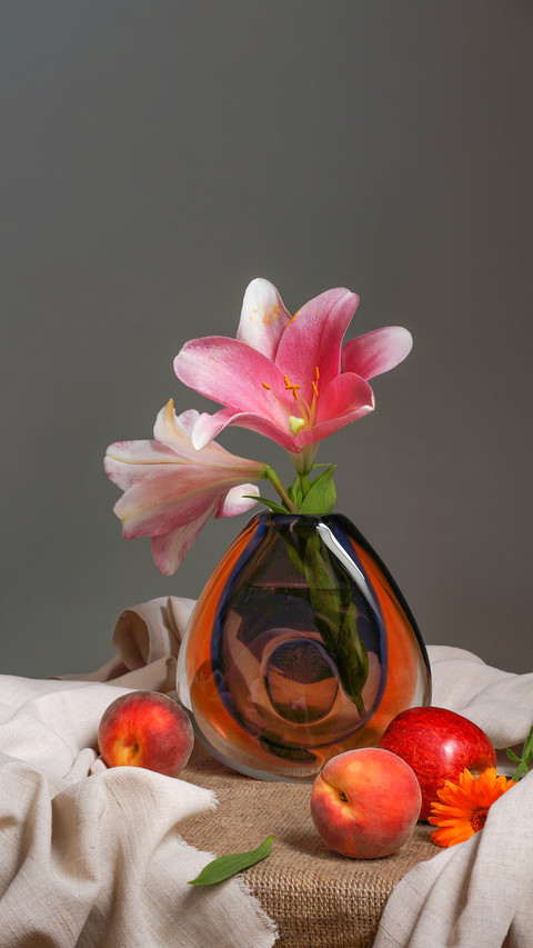 Studio still life with flowers lilies and fruits in vintage preview