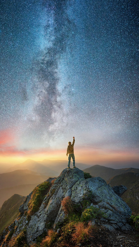A Man Stands on The Top of The Mountain Under The Stars preview
