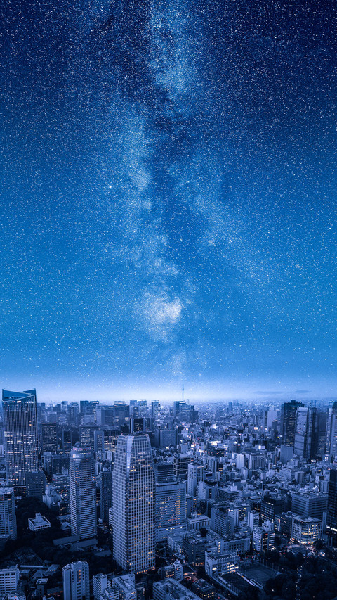 Stars of the Milky Way over Big City Skyline at Night preview