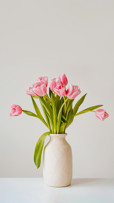 Beautiful pink tulip flowers bouquet in ceramic vase preview