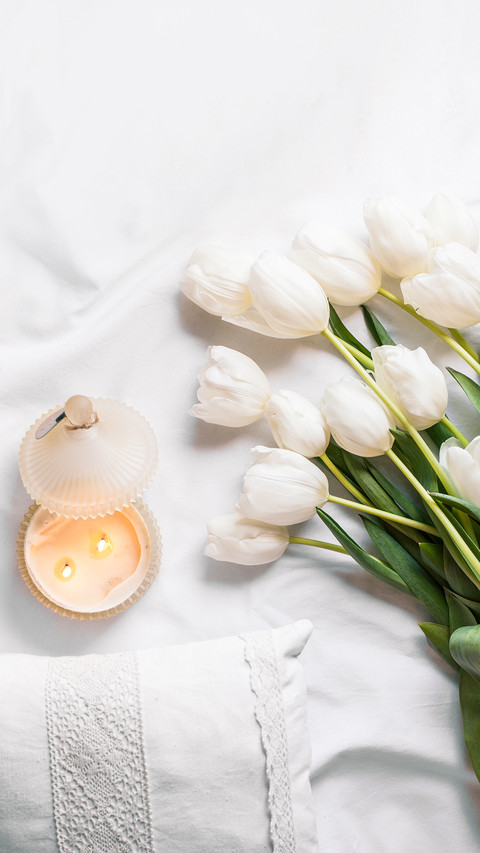 Spring Flowers Tulips with Candles and White Pillows preview