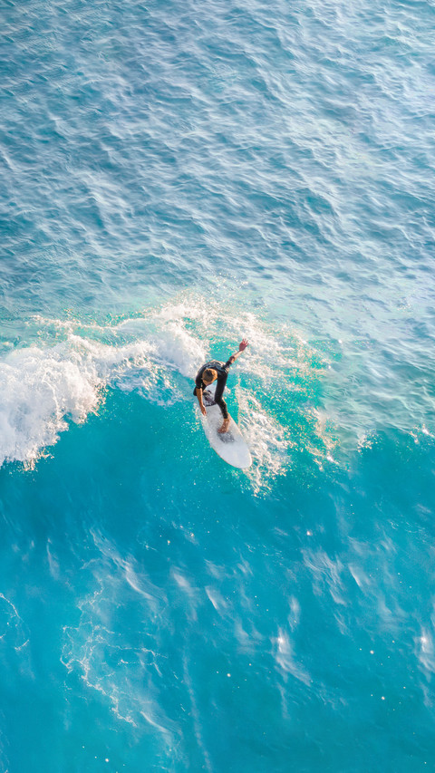 Surfer at the top of the wave in the ocean preview