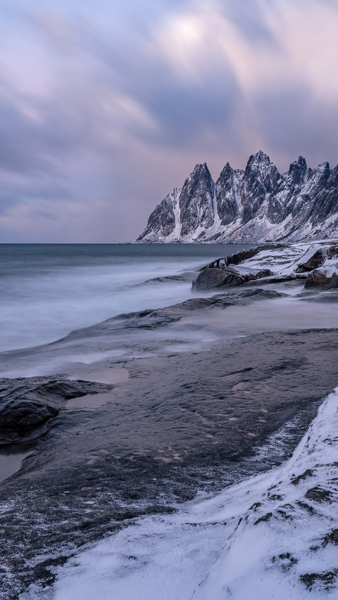 The snowcapped mountain coast of senia island preview