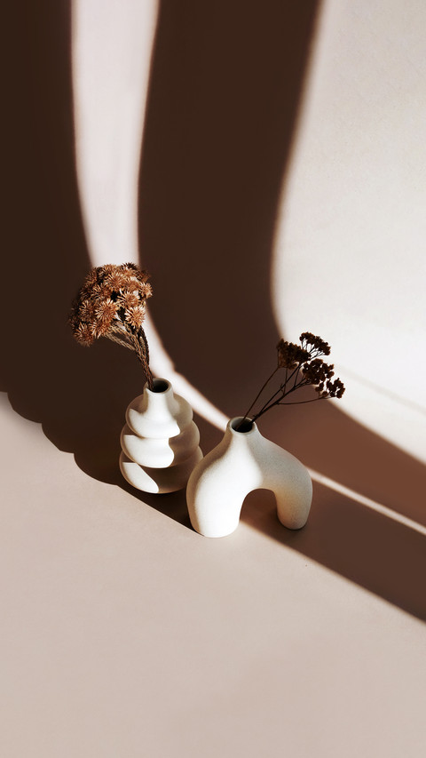 Modern beige ceramic vases set with dry grass preview