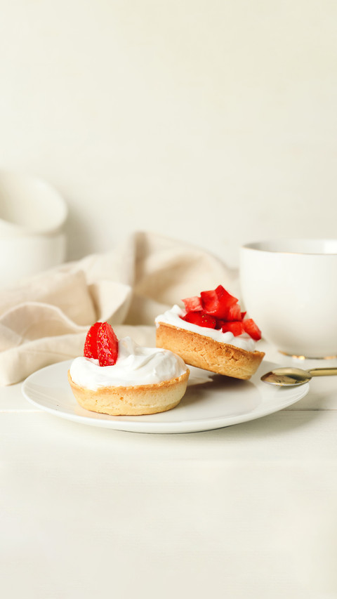 Plate with tasty tartlets on table preview