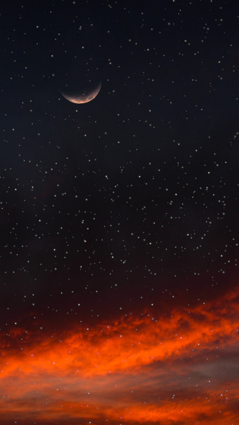 The night moon hangs low, reflecting on the vast sky preview