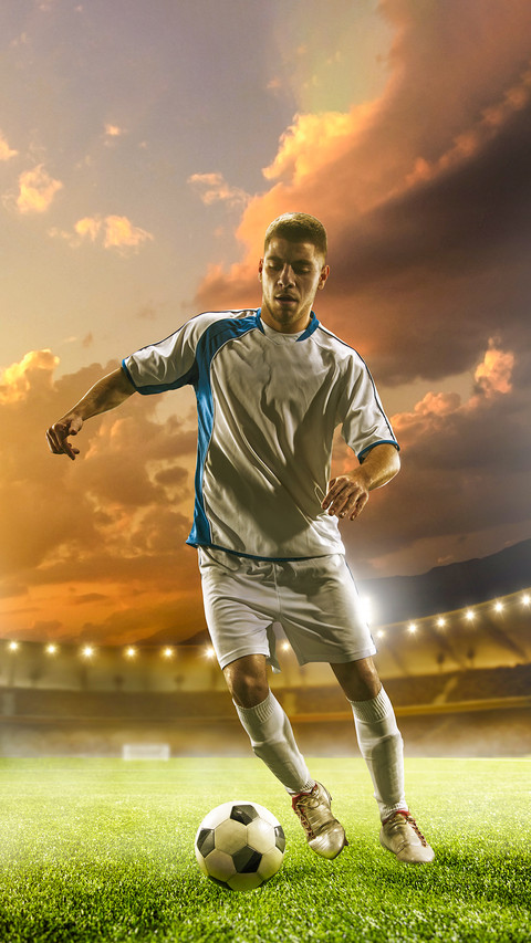 Soccer player in action on sunset stadium background preview
