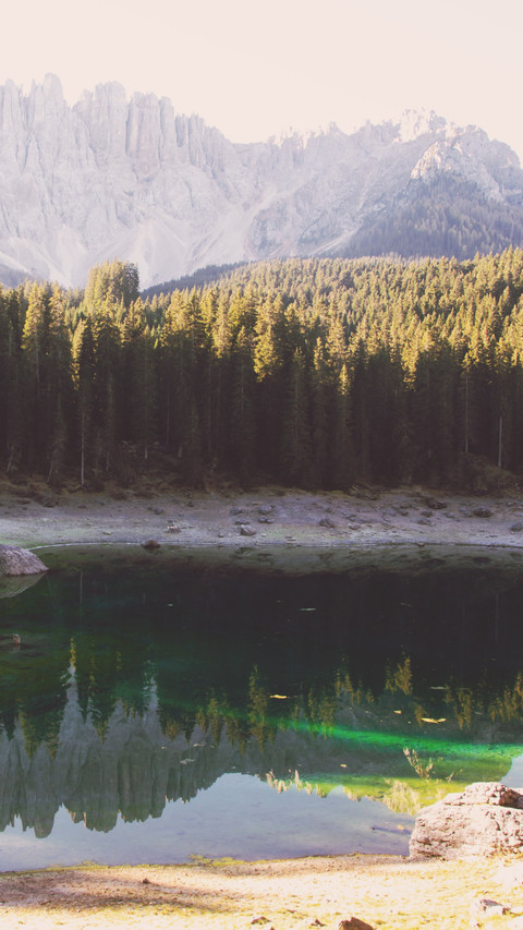 The morning light of the Alps reflects on the lake preview
