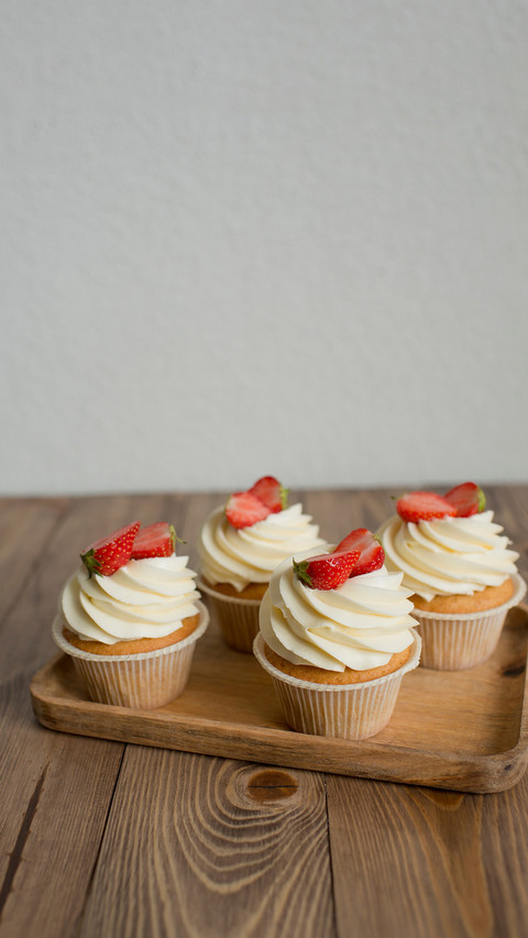Pastries decorated with strawberries on the table preview